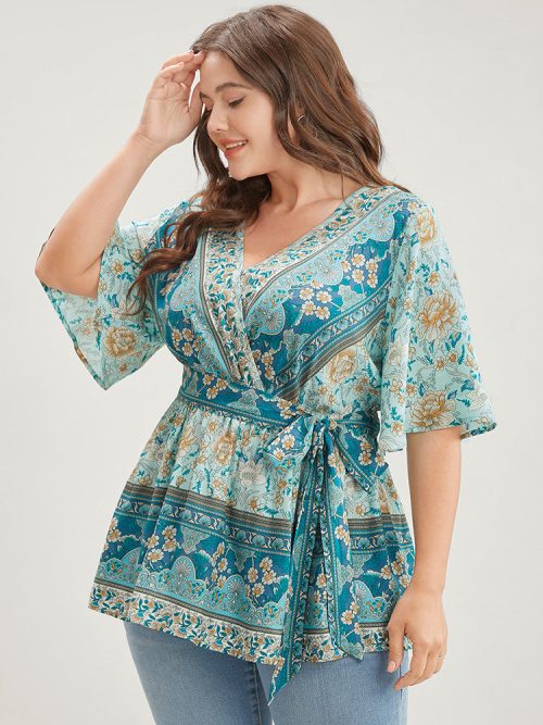 877579544-va-355b6567-e536-4812-ad1d-603085b33577-1 Floral Print Ruffles Belted Wrap Blouse